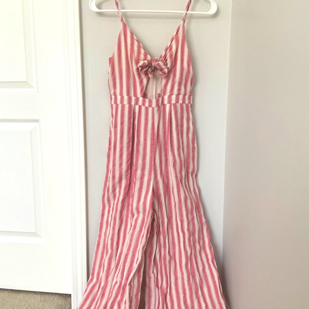 Pink striped jumpsuit with tie front